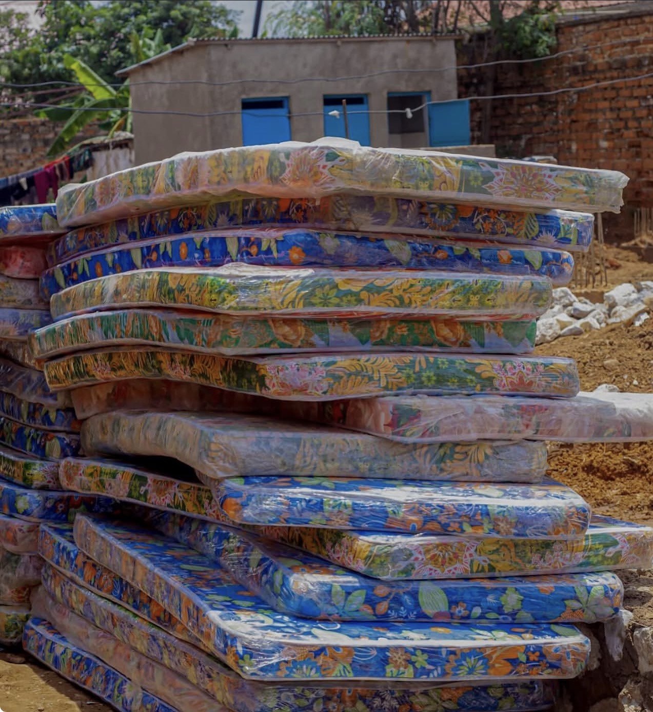 Mattresses stacked and wrapped, ready for delivery in Lubumbashi